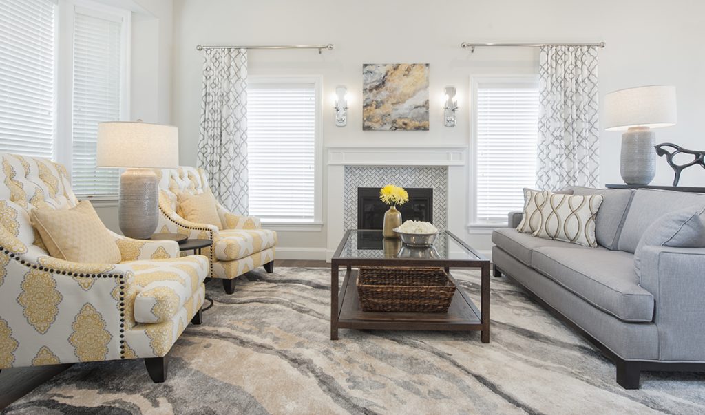 pretty living room in soft colour palette with fireplace focal point
